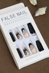 Elegant Black and Nude Press-On Nails – Floral and Line Art Design for a Sophisticated Look