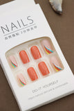 Vibrant Flair: Bold Orange Nails with a Splash of Multicolored Accents – Add a Pop of Fun to Your Style!