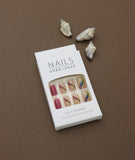 Nude Press-On Nails with Vibrant Floral Pattern and Maroon Accent – Nature’s Touch