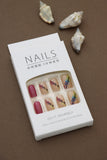 Nude Press-On Nails with Vibrant Floral Pattern and Maroon Accent – Nature’s Touch