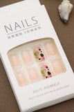 Peach Nude Press-On Nails with Gradient Pink and Yellow Heart Design
