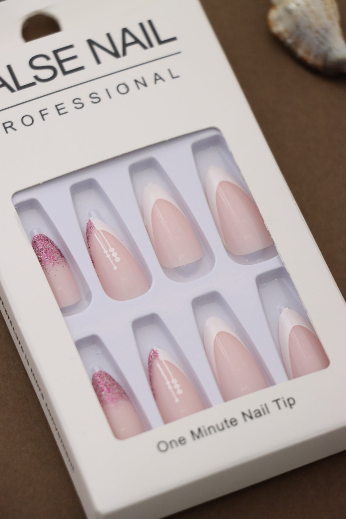 Elegance Redefined – Soft Pink French Tips with Glittering Pink Accents and Subtle Floral Detailing. These Sophisticated Press-On Nails Bring Classic Beauty to Any Occasion.
