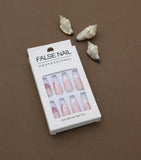 Elegance Redefined – Soft Pink French Tips with Glittering Pink Accents and Subtle Floral Detailing. These Sophisticated Press-On Nails Bring Classic Beauty to Any Occasion.