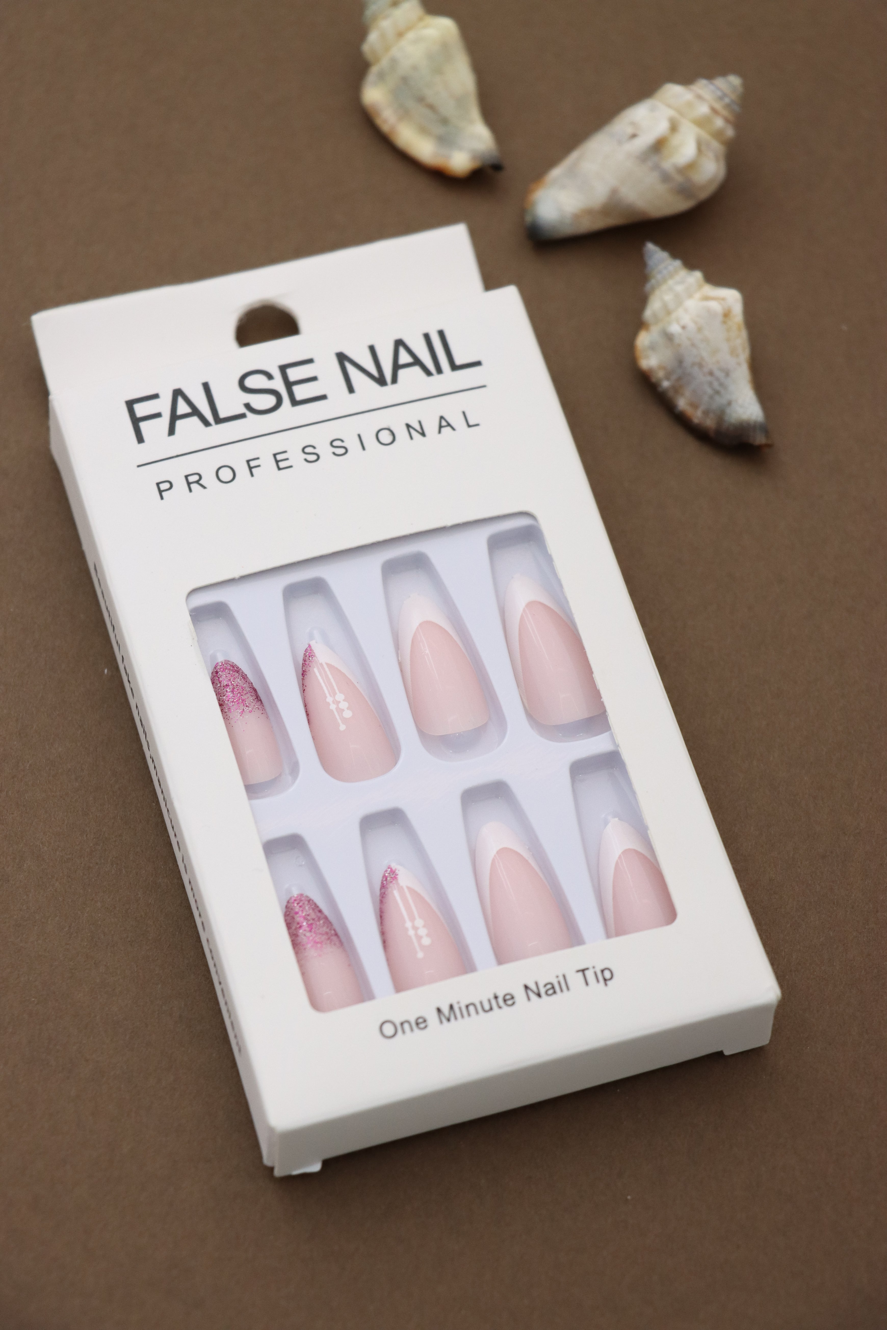 Elegance Redefined – Soft Pink French Tips with Glittering Pink Accents and Subtle Floral Detailing. These Sophisticated Press-On Nails Bring Classic Beauty to Any Occasion.