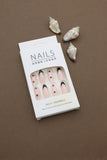 Nude Almond Press-On Nails with Black French Tips, Star Accents, and Gold Detailing - 24pcs Set