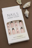 Nude Almond Press-On Nails with Black French Tips, Star Accents, and Gold Detailing - 24pcs Set