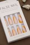 Golden Sunrise Swirl Press-On Nails with Orange and Gold Accents - Professional Finish