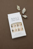 Tropical Elegance: Beige Nails with Exquisite Leafy Botanical Patterns – A Serene Touch of Nature at Your Fingertips!