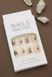Tropical Elegance: Beige Nails with Exquisite Leafy Botanical Patterns – A Serene Touch of Nature at Your Fingertips!
