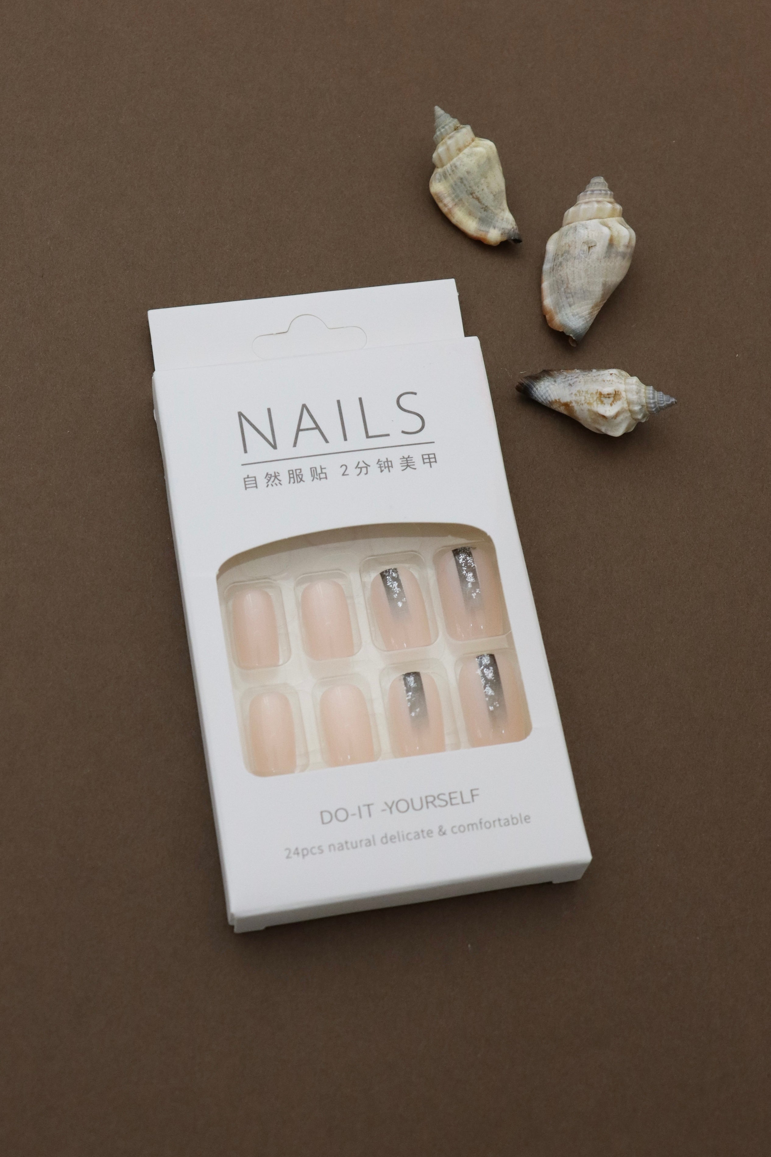 Silver Ombre Glitter Nails – A Chic Fusion of Neutral Tones and Sparkling Glamour. Elevate Your Look with These Elegant and Trendy Tips. Perfect for Effortless Styling and Comfortable Wear