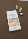 Playful Delight: Soft Peach Nails with Green Tips and Adorable Strawberry Accents – A Refreshing Pick for a Fun Look!
