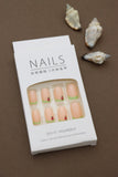 Playful Delight: Soft Peach Nails with Green Tips and Adorable Strawberry Accents – A Refreshing Pick for a Fun Look!