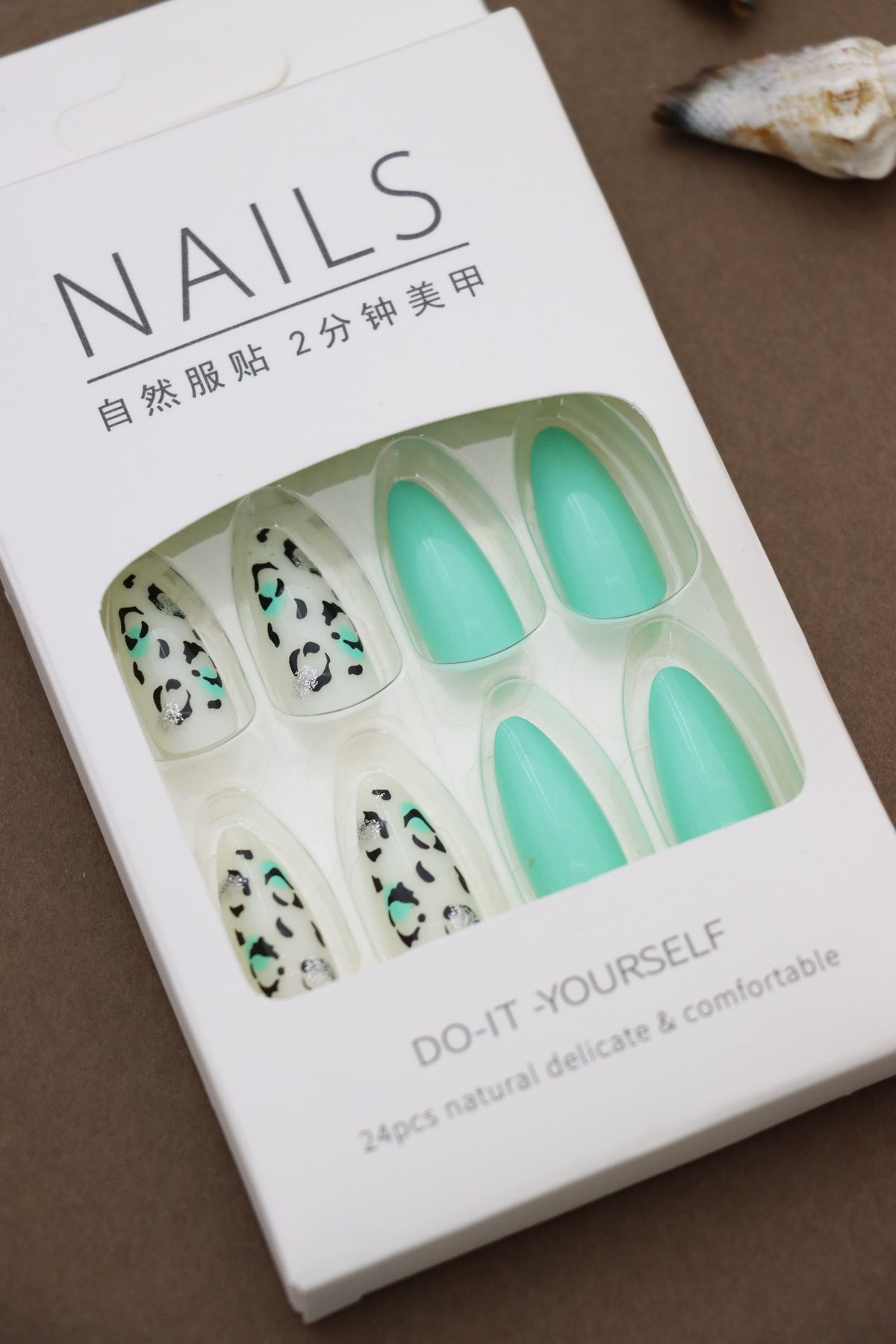 Wild Elegance: Mint Green Nails Paired with Chic Leopard Print for a Bold, Fashion-Forward Look!