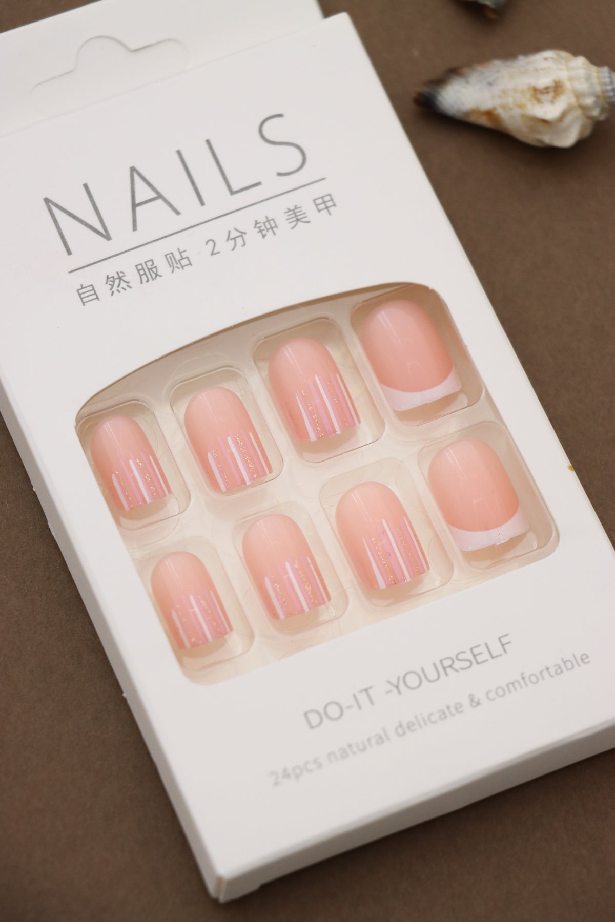 Soft Pink Radiance: Elevate Your Nails with Subtle Stripes of Sparkling Elegance. The Perfect Blend of Simplicity and Glamour for Any Occasion!