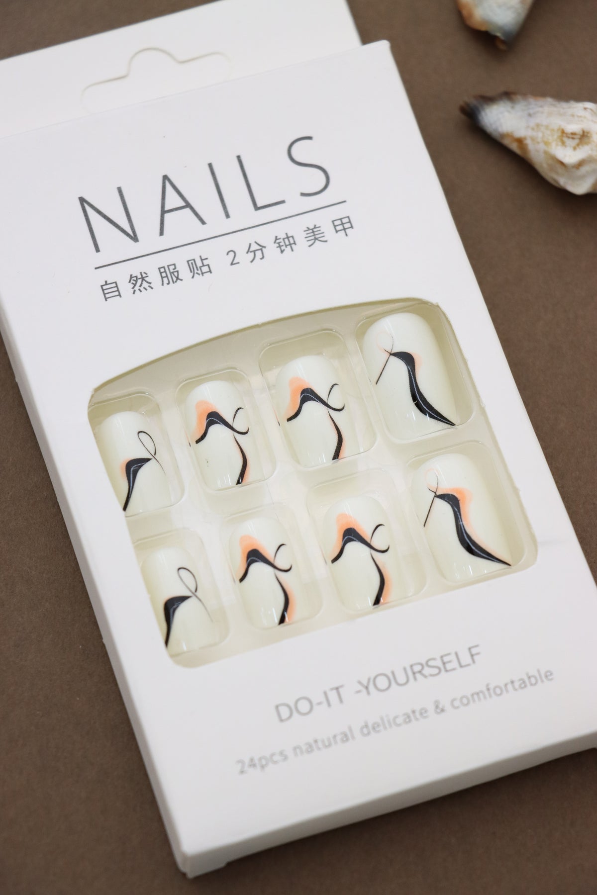 Ivory Abstract Wave Press-On Nails - Sophisticated Swirls in Black & Peach Accents