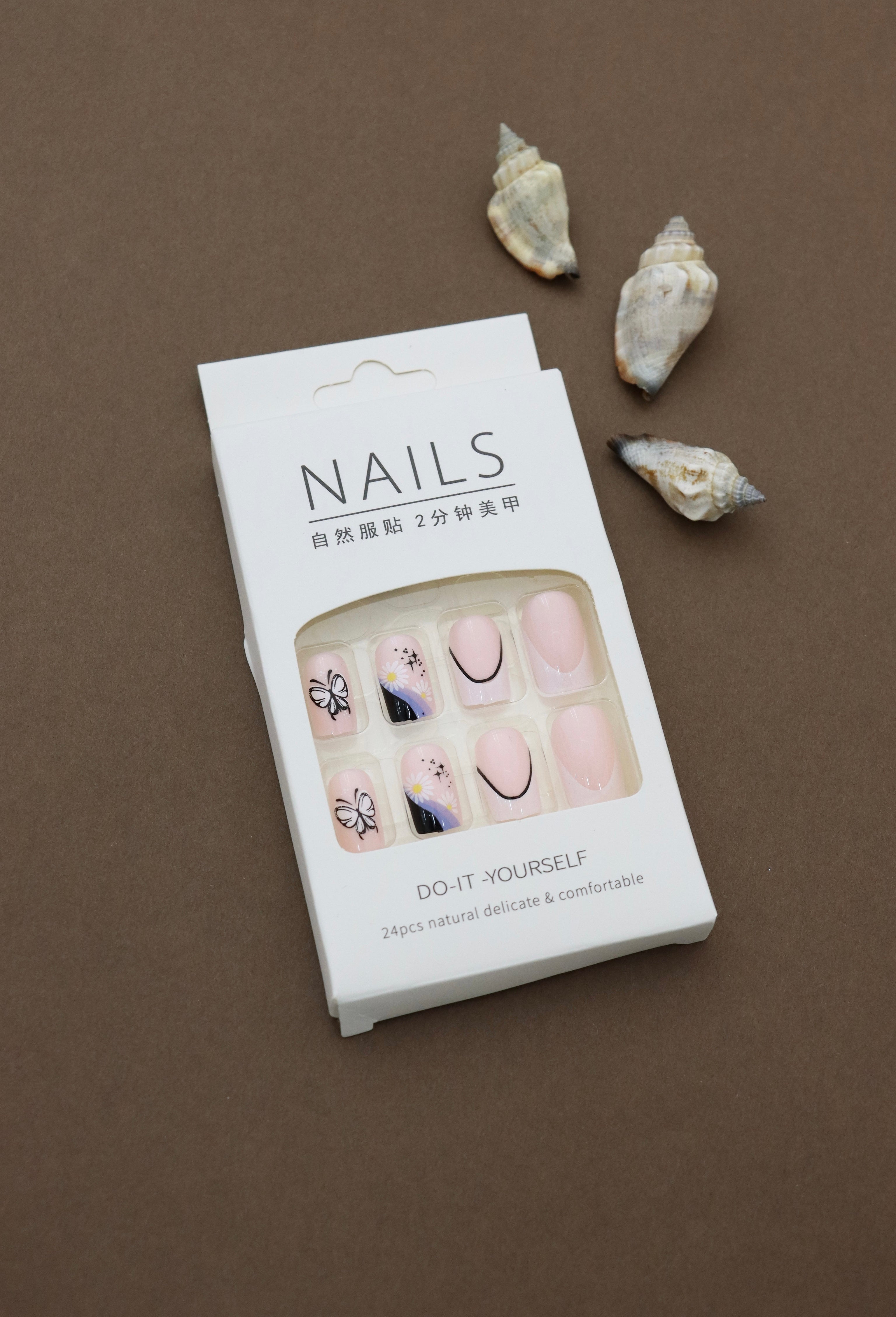 Pastel Pink Press-On Nails with Butterfly, Daisy, and Black Accent Art