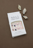 Pastel Pink Press-On Nails with Butterfly, Daisy, and Black Accent Art