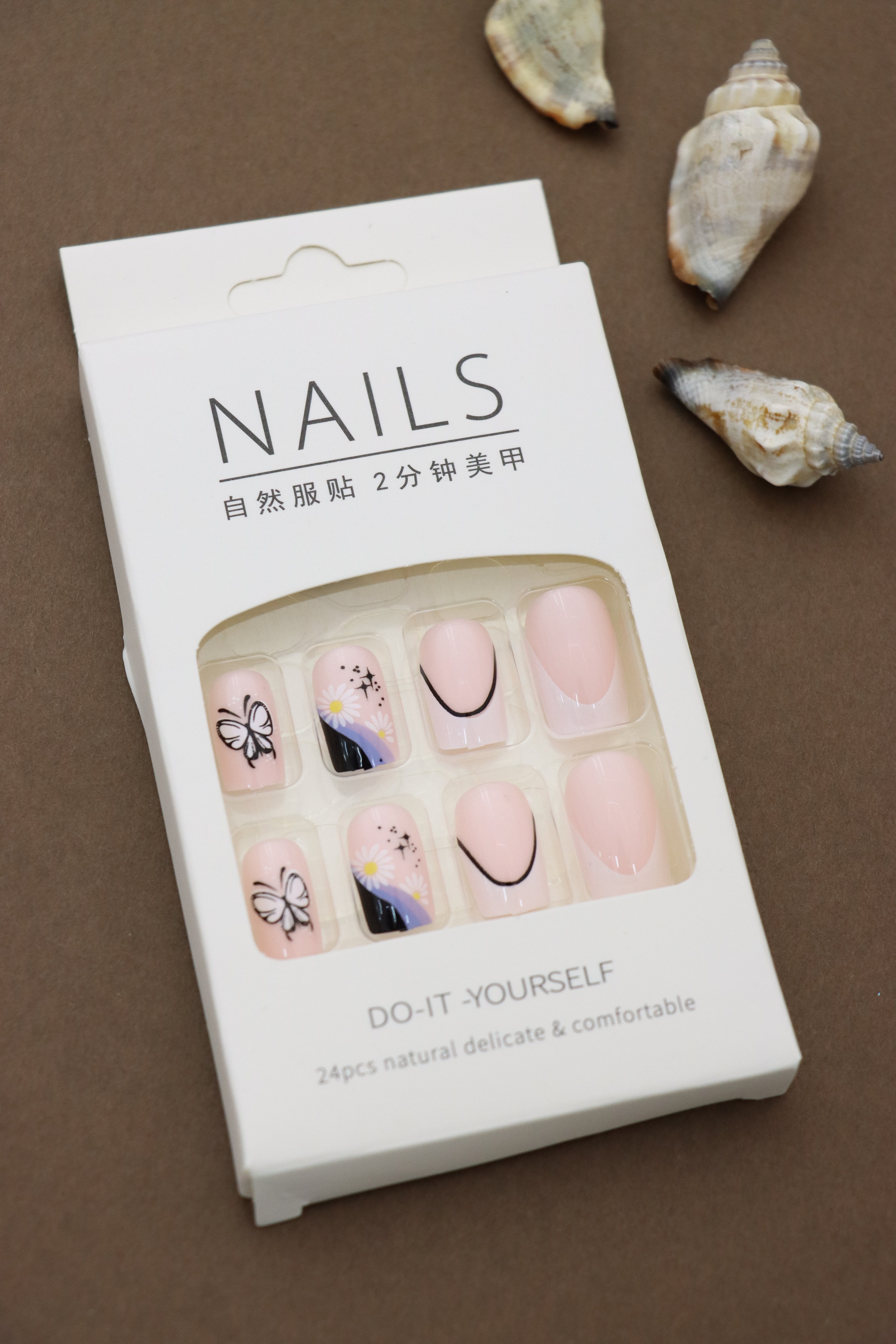Pastel Pink Press-On Nails with Butterfly, Daisy, and Black Accent Art