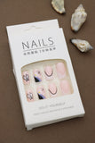 Pastel Pink Press-On Nails with Butterfly, Daisy, and Black Accent Art