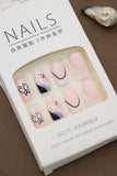 Pastel Pink Press-On Nails with Butterfly, Daisy, and Black Accent Art