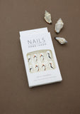 Ivory Abstract Wave Press-On Nails - Sophisticated Swirls in Black & Peach Accents
