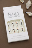 Ivory Abstract Wave Press-On Nails - Sophisticated Swirls in Black & Peach Accents