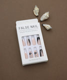 Professional Nude Press-On Nails with Black Floral Accents, Glitter Detailing, and Elegant French Tips - 24pcs Set
