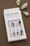 Professional Nude Press-On Nails with Black Floral Accents, Glitter Detailing, and Elegant French Tips - 24pcs Set