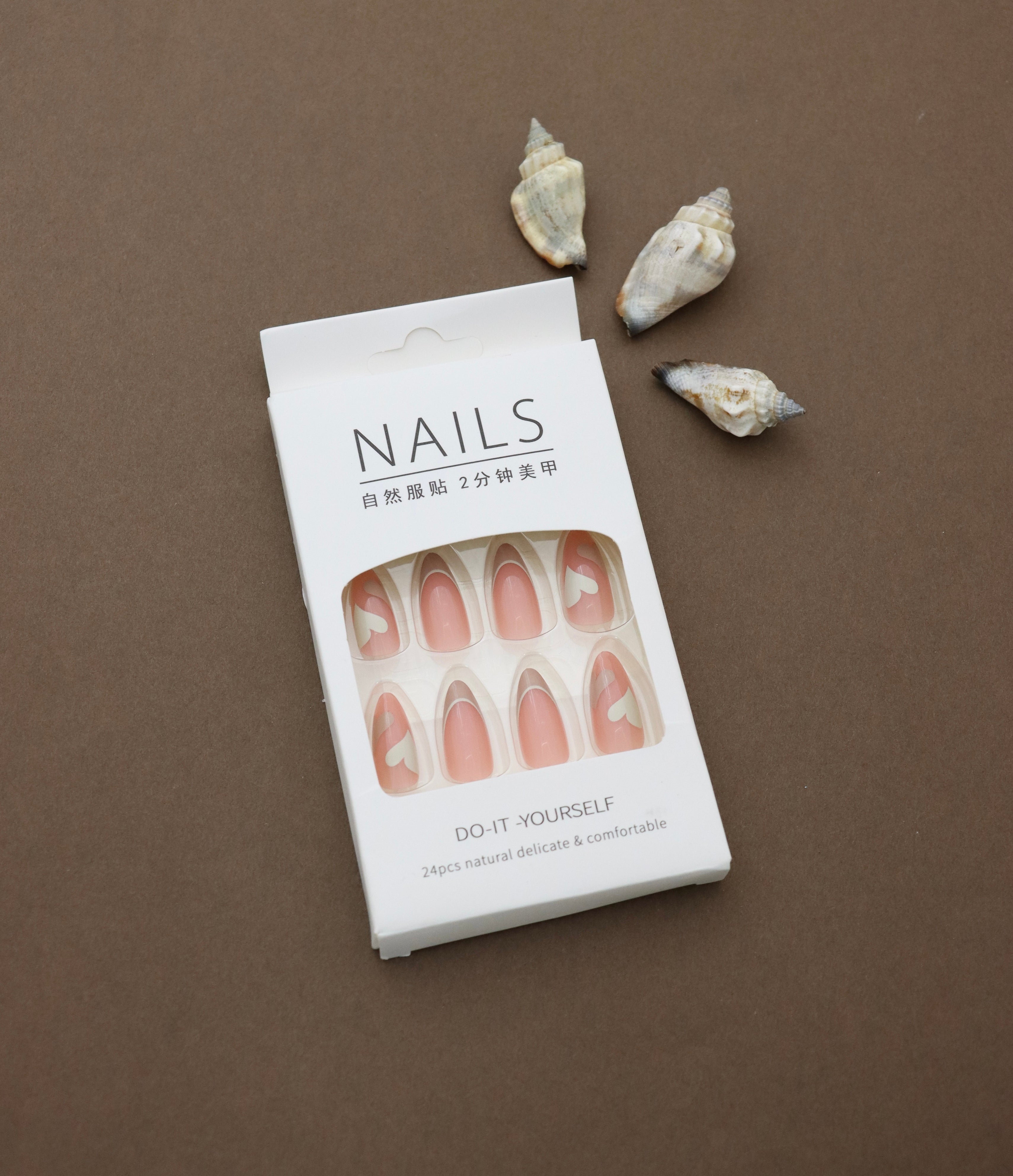 Sweeten your style with these heart-accented press-on nails! Featuring a soft pink base and playful white hearts, they’re the perfect accessory for a romantic and trendy look.