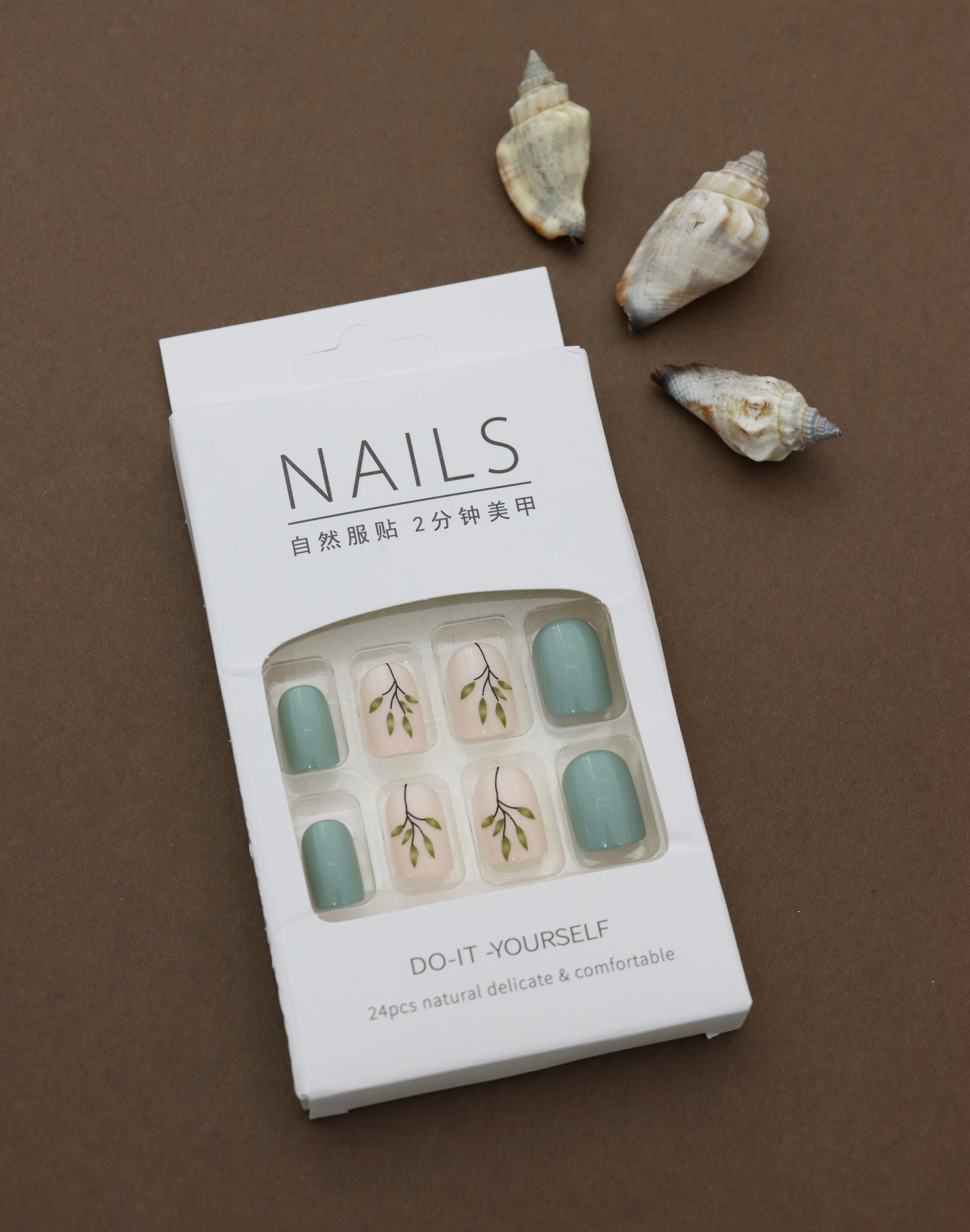 Earthy Greenery – A Tranquil Blend of Mint Green Solids and Elegant Leafy Accents. These Nature-Inspired Press-On Nails Offer Effortless Style and Natural Beauty for Your Everyday Look.