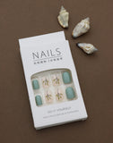 Earthy Greenery – A Tranquil Blend of Mint Green Solids and Elegant Leafy Accents. These Nature-Inspired Press-On Nails Offer Effortless Style and Natural Beauty for Your Everyday Look.
