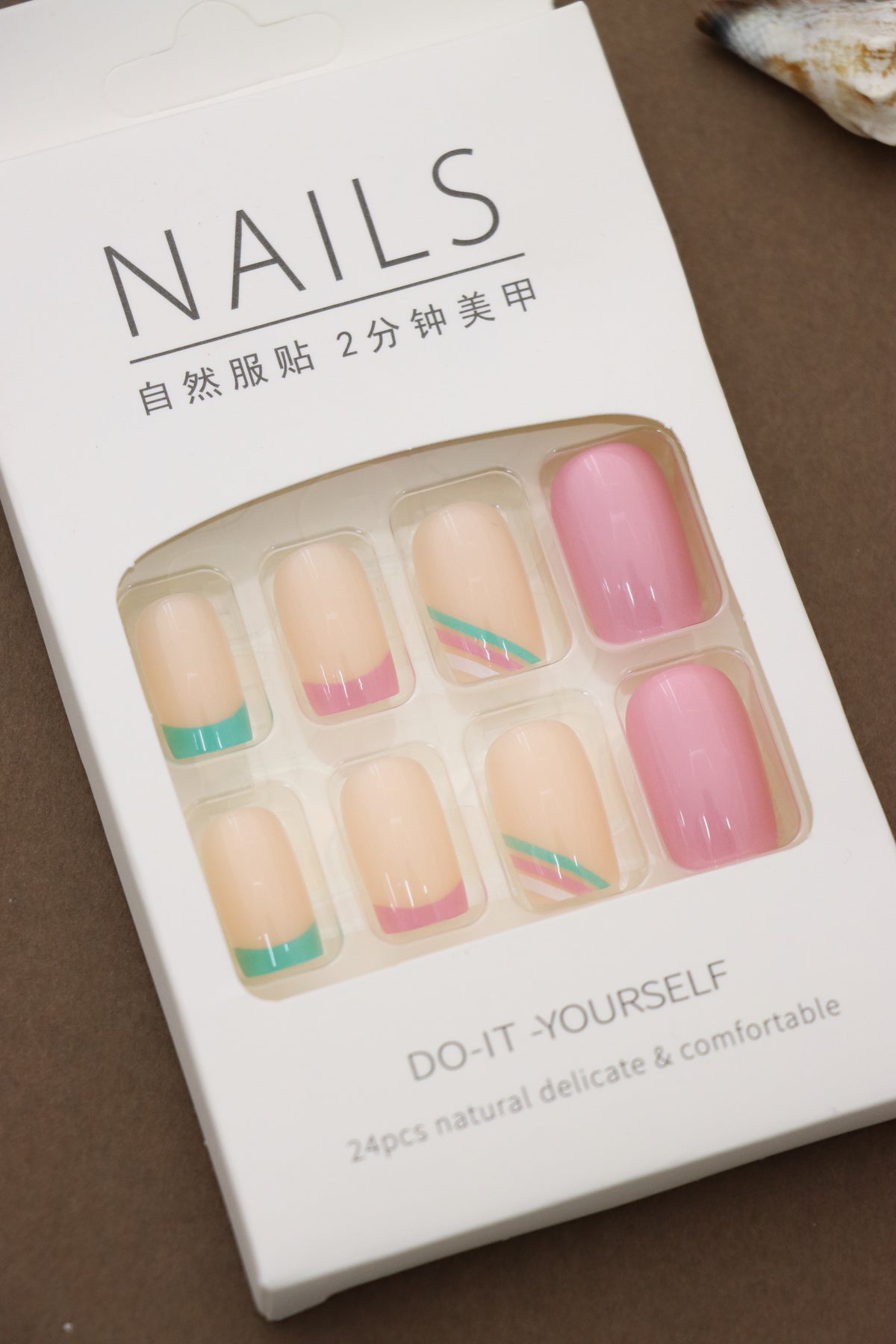 Pastel Perfection: Soft Beige Nails with Colorful Pink and Teal Accents – The Ultimate Blend of Subtlety and Style!